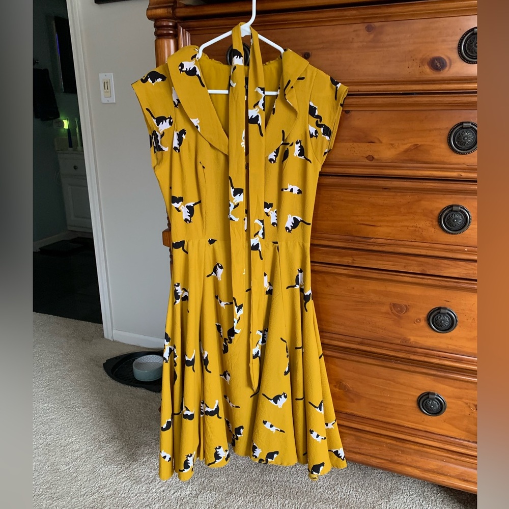 Collectif (UK Brand) yellow dress with black and white cat print with ruffles. S
